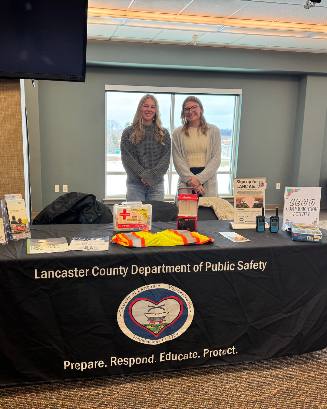 LBC Career Fair, two women standing behind a display table